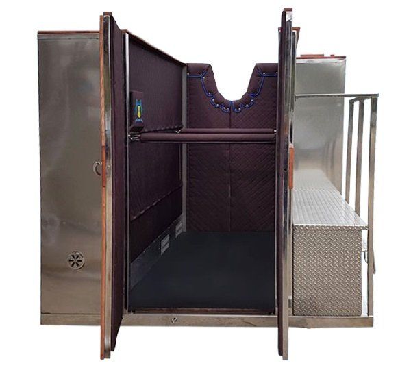 The inside of a stainless steel cryochamber with the doors open