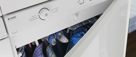 clothing on hooks in dryer