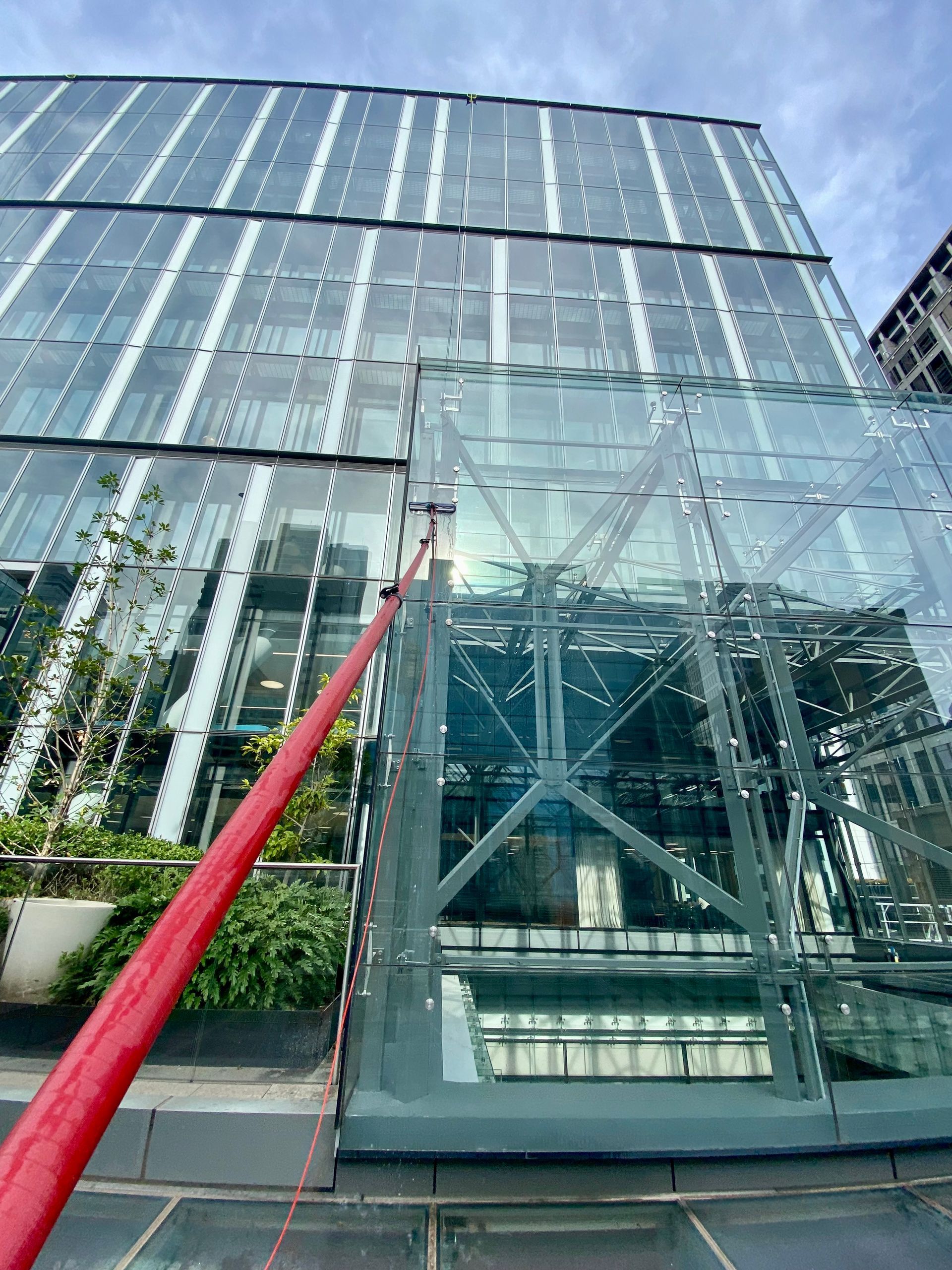 Looking Up At A Tall Building Covered In Green Plants — Freshwater Exterior Cleaning in Lennox Head, NSW
