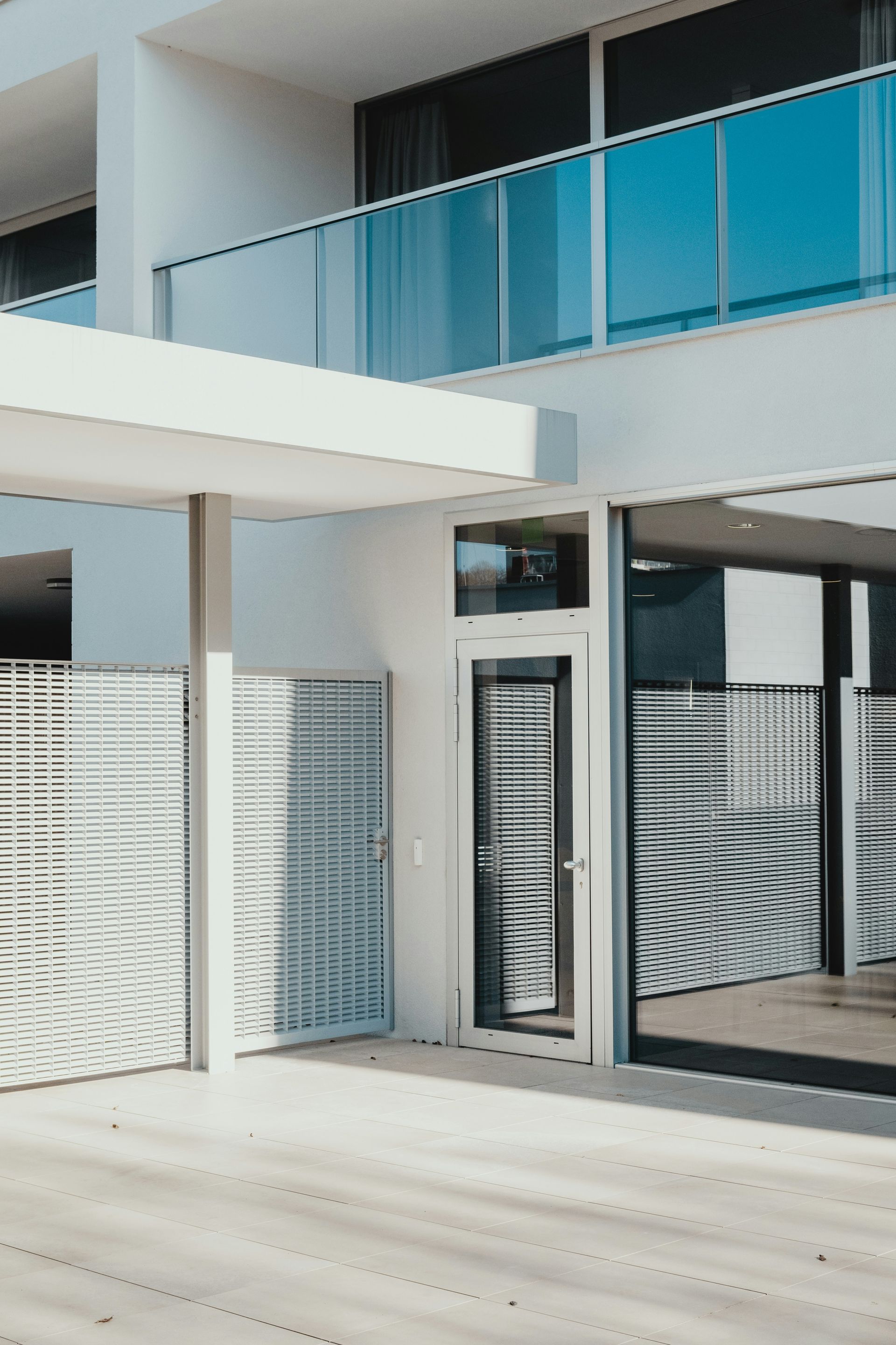 A Person Is Climbing Up A Building With A Rope — Freshwater Exterior Cleaning in Lennox Head, NSW