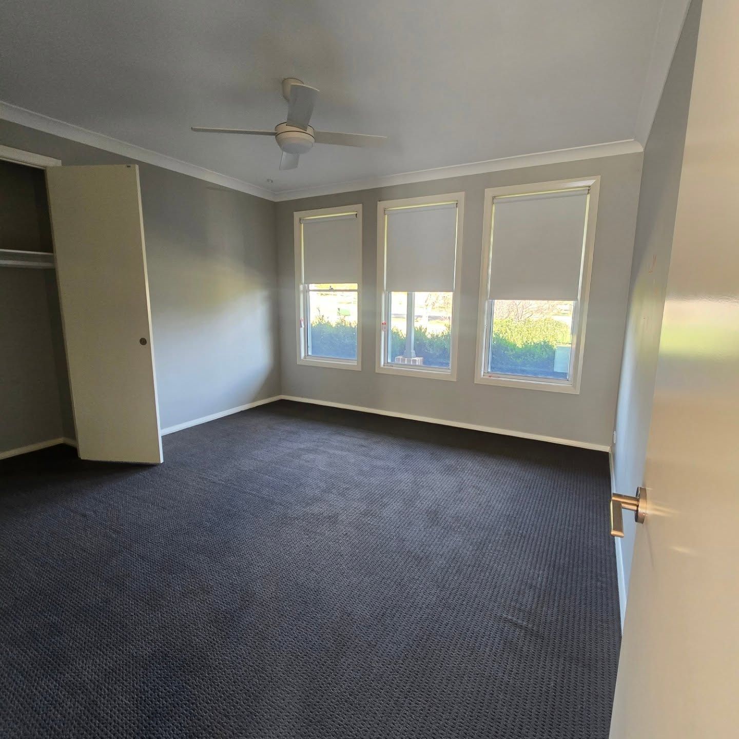 Wooden Floor House with White Walls and Two Lamps on Right side which are either side of the Door — A Perfect Move And Clean In Bowral NSW