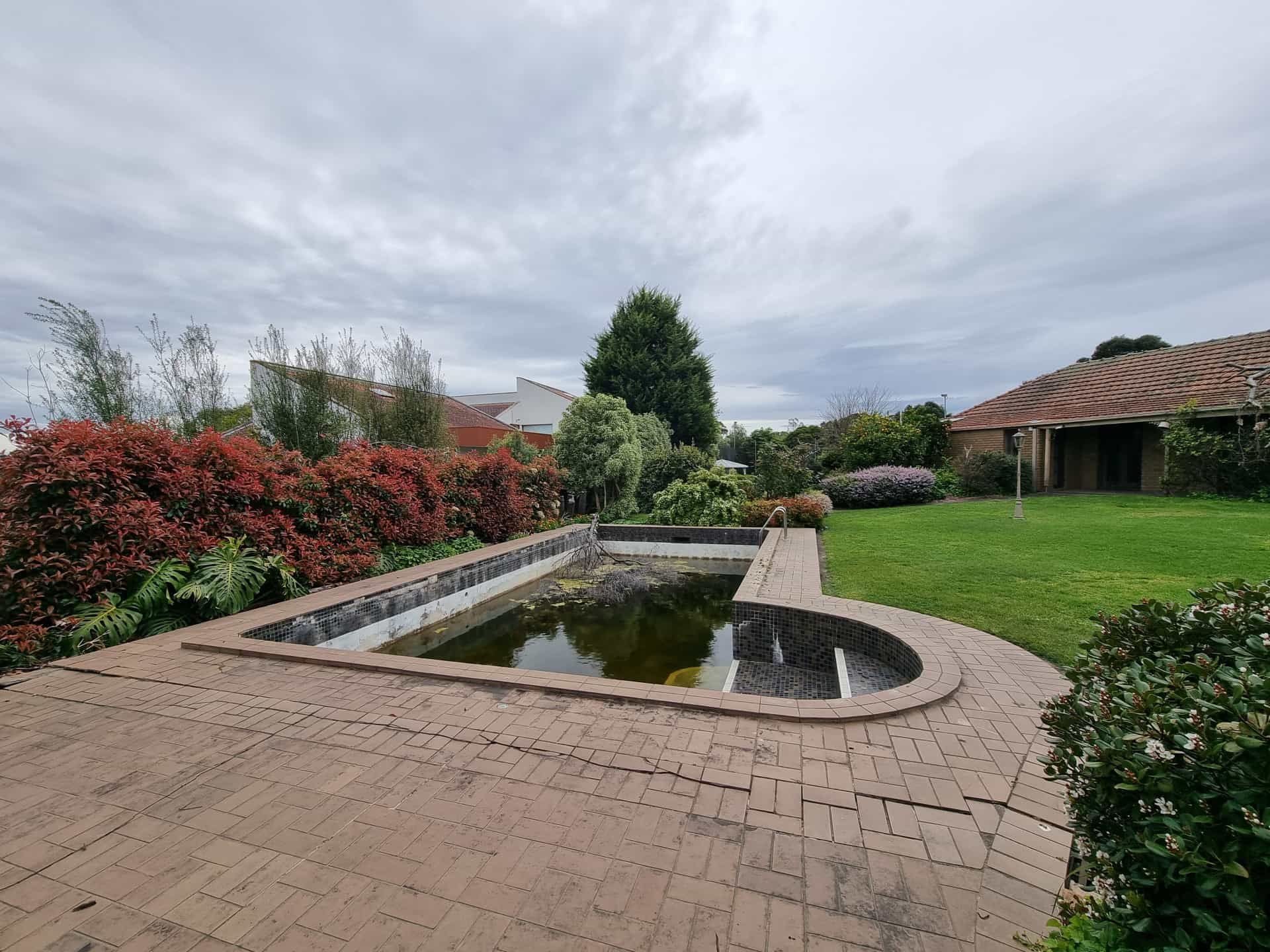 Garden Patio With a Reflective Pond, Brick Paving — All Over Pool Removals in Upwey, VIC