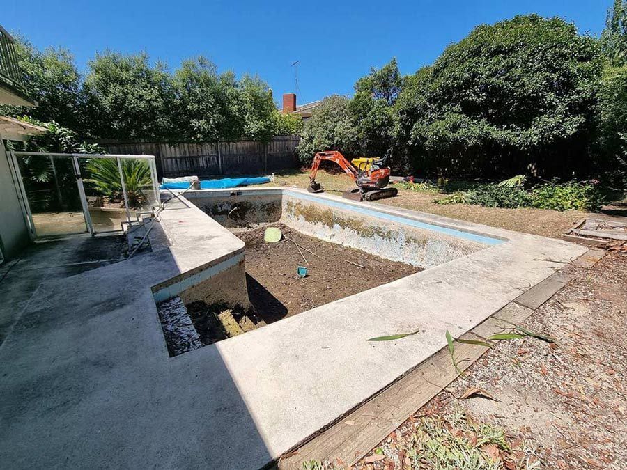 Excavator at a Backyard Pool, Partially Demolished — All Over Pool Removals in Surrey Hills, VIC
