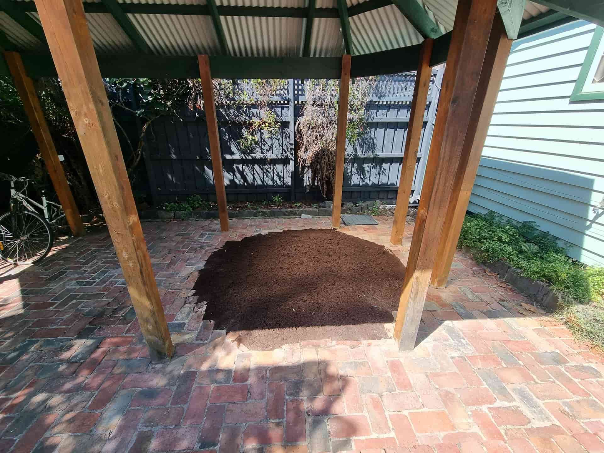 Gazebo on Brick Patio With a Circular Dirt Bed in the Centre — All Over Pool Removals in Templestowe, VIC