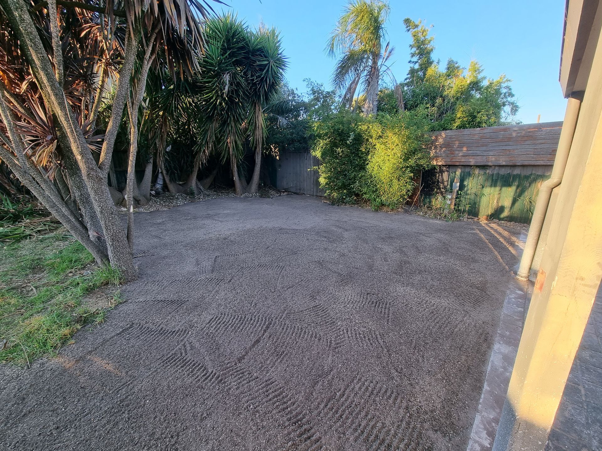 A Freshly Levelled, Gravel-covered Area Adjacent to a House Wall — All Over Pool Removals in Doncaster, VIC