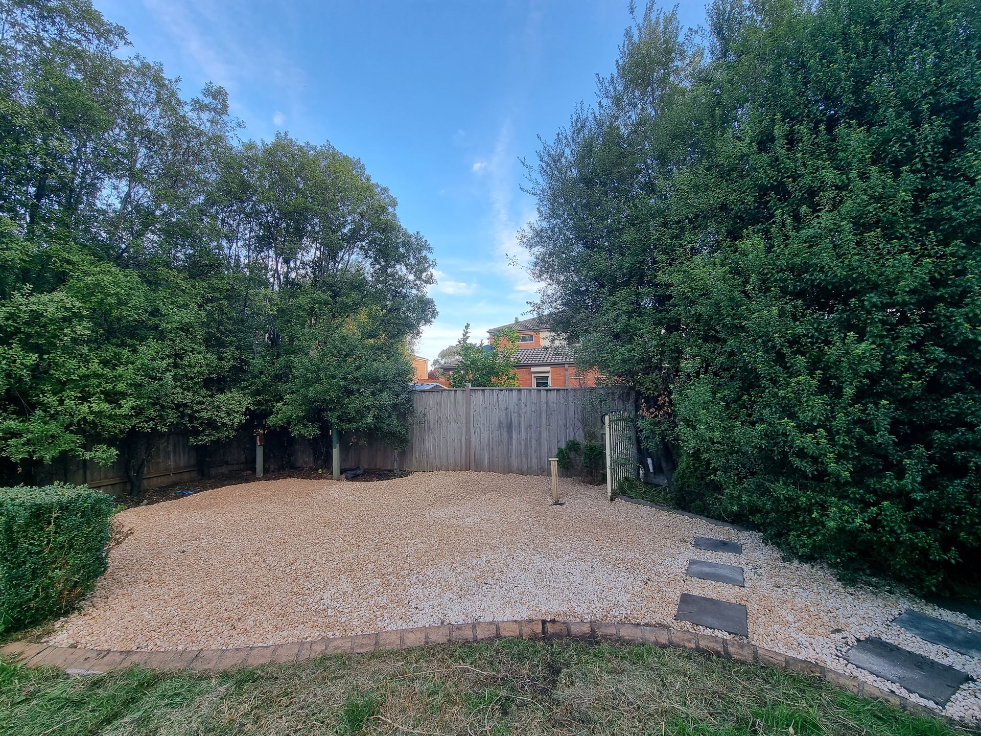 Backyard With a Gravel Area, Surrounding Trees — All Over Pool Removals in Upwey, VIC