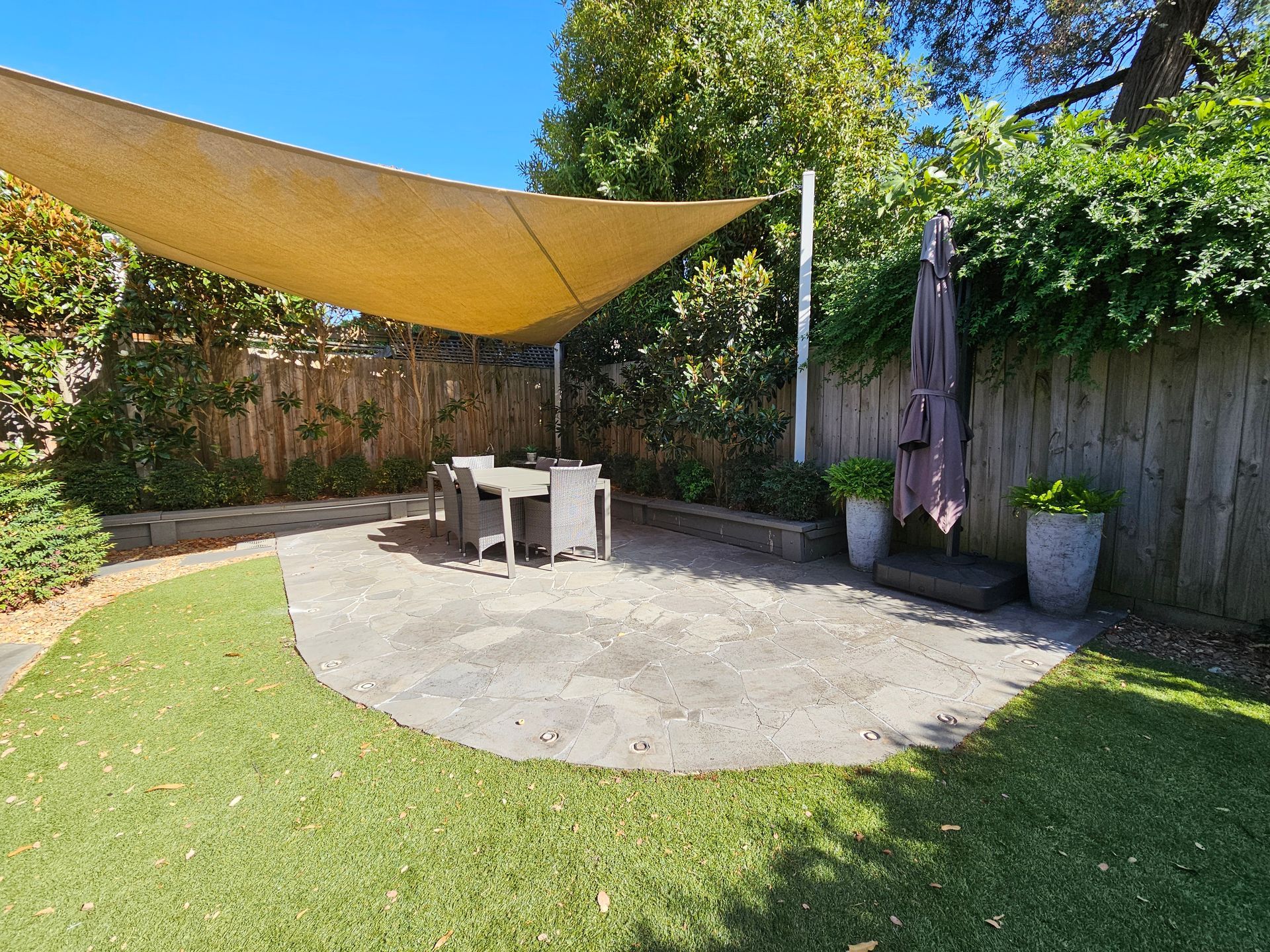 Backyard Patio With Shade Sail, Table and Chairs — All Over Pool Removals in Upwey, VIC