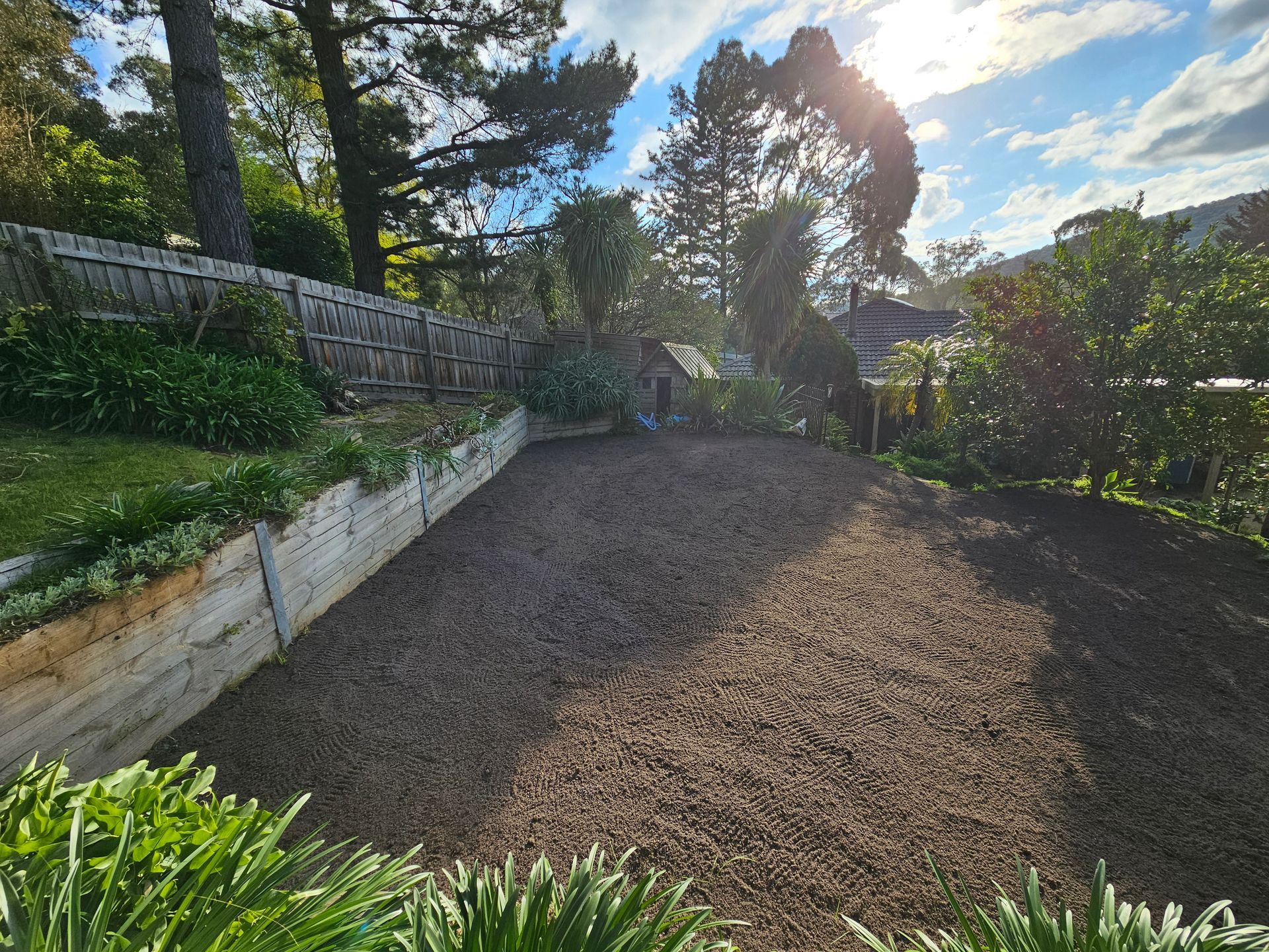 Gravel Path Beside a White Retaining Wall and Greenery — All Over Pool Removals in Upwey, VIC