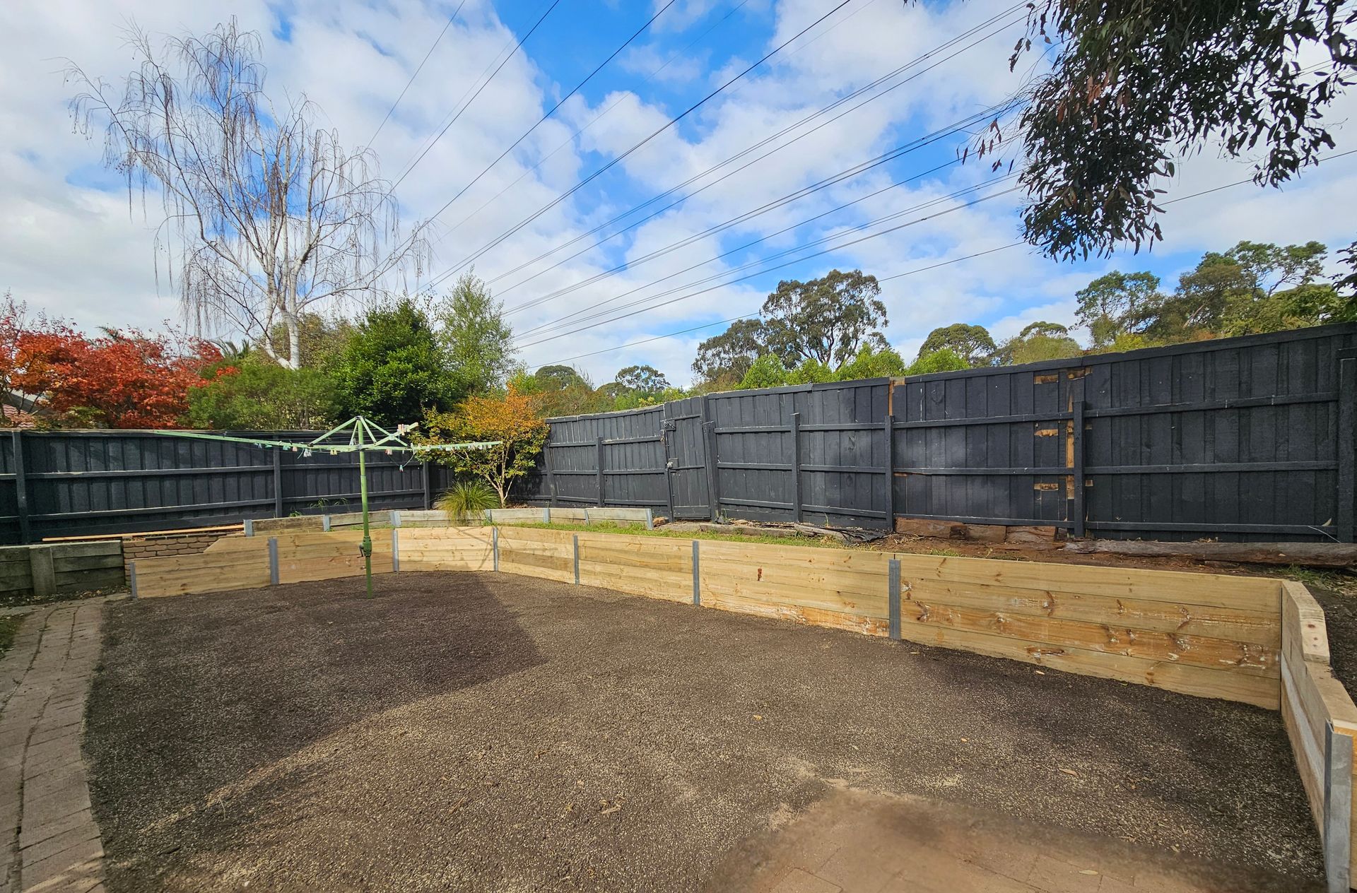 Backyard With Dirt Ground, Retaining Wall — All Over Pool Removals in Glen Waverley, VIC
