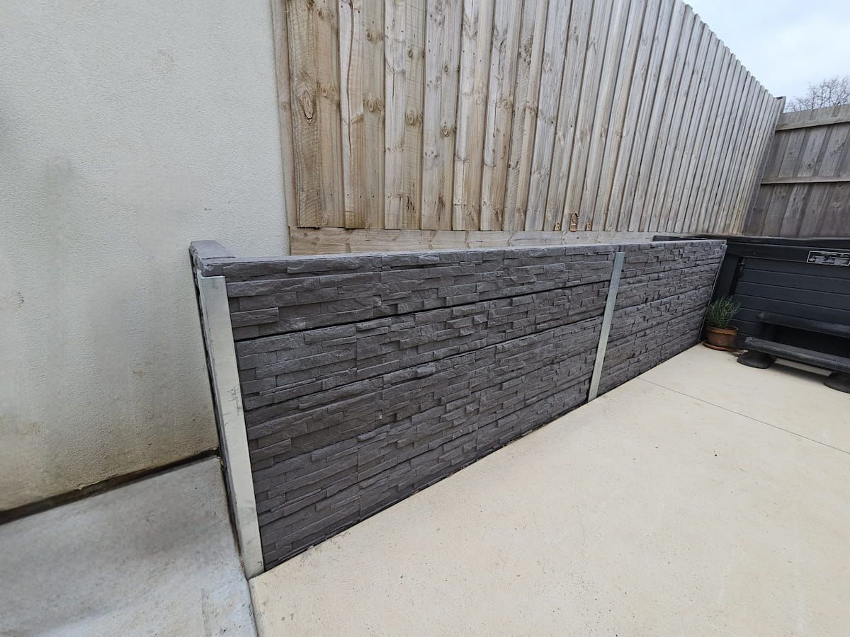 Wooden Fence With Gray Retaining Wall Panels — All Over Pool Removals in Upwey, VIC