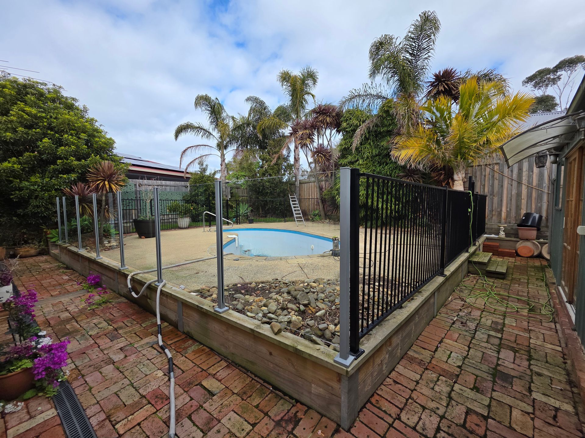 Backyard With a Small Fenced Pool, Brick Patio — All Over Pool Removals in Upwey, VIC