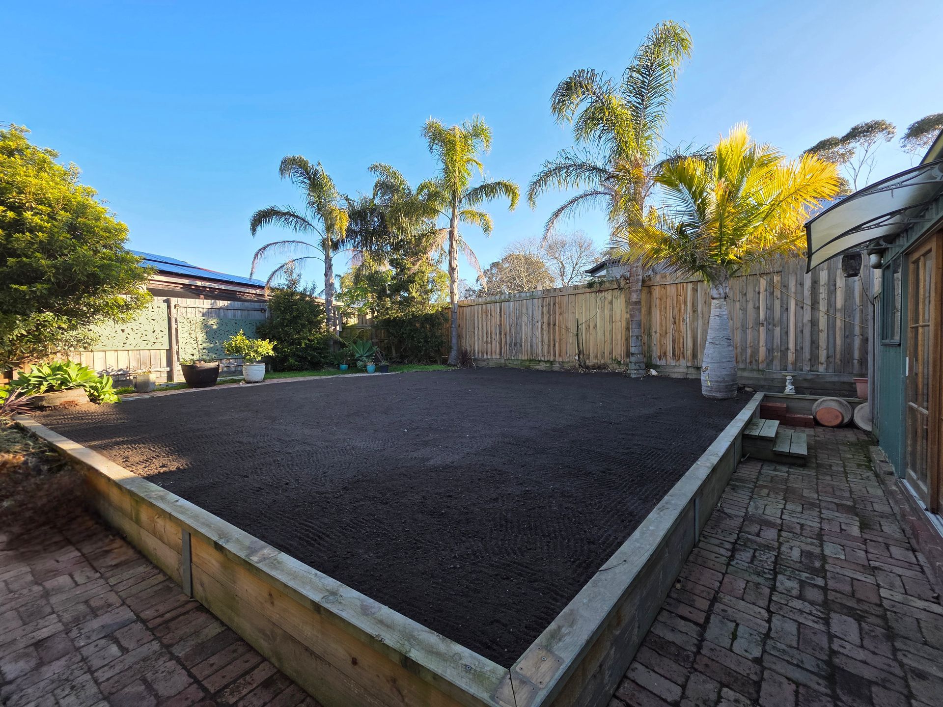 Backyard With Raised Dark Soil Bed — All Over Pool Removals in Upwey, VIC