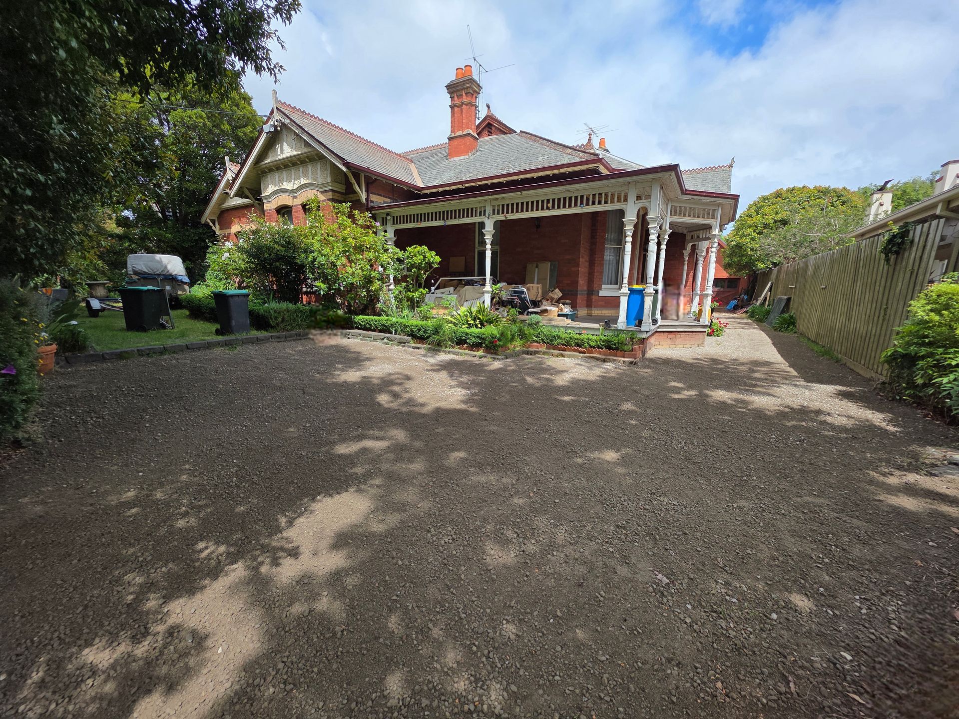 Backyard With Bare Soil, a Brick House, and a Partly Cloudy Sky — All Over Pool Removals in Upwey, VIC