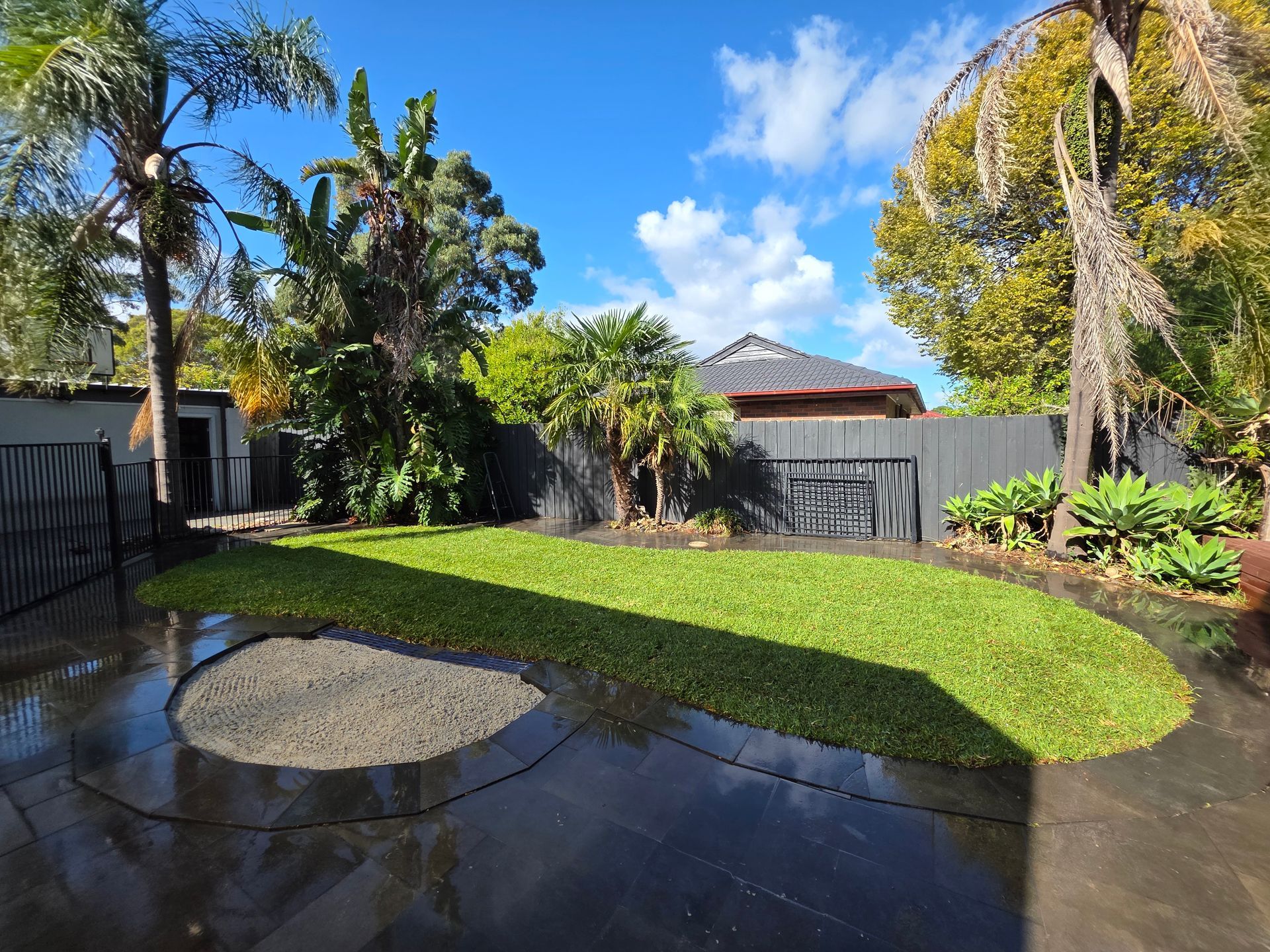 Backyard Patio With Wet Concrete, Circular Fire Pit — All Over Pool Removals in Upwey, VIC