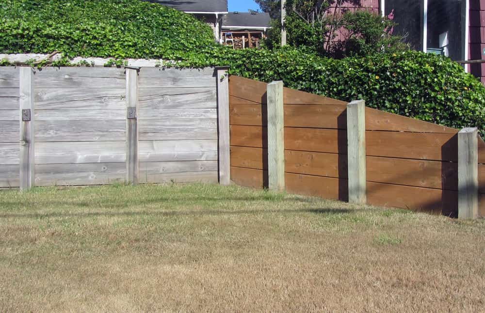 Wooden Retaining Wall With Brown and Grey Planks — All Over Pool Removals in Narre Warren South, VIC