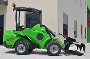 Green Compact Loader With Grapple — Lawn Care in Umina Beach, NSW