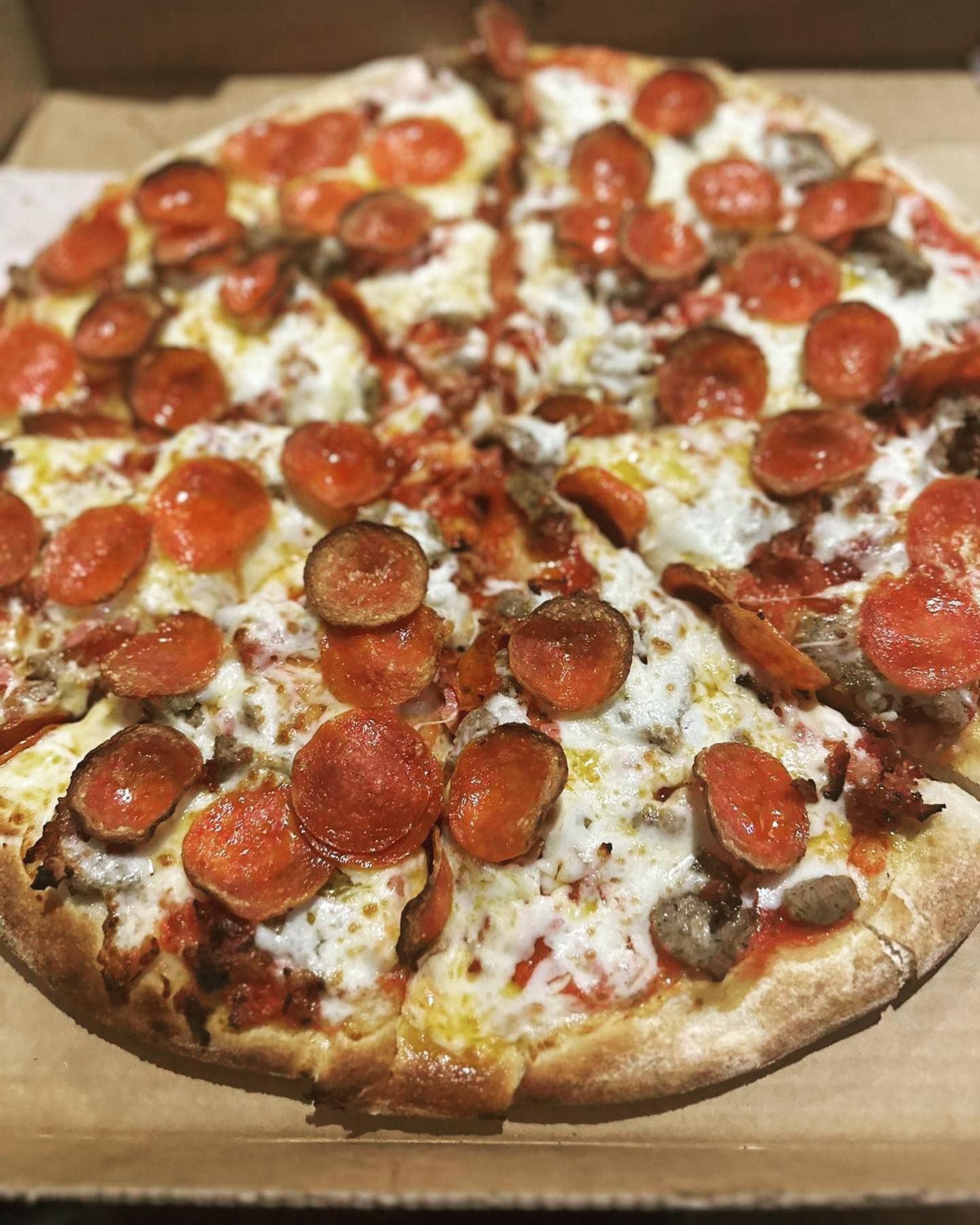 Takeout pepperoni pizza at Big Louie’s Pizzeria Florida