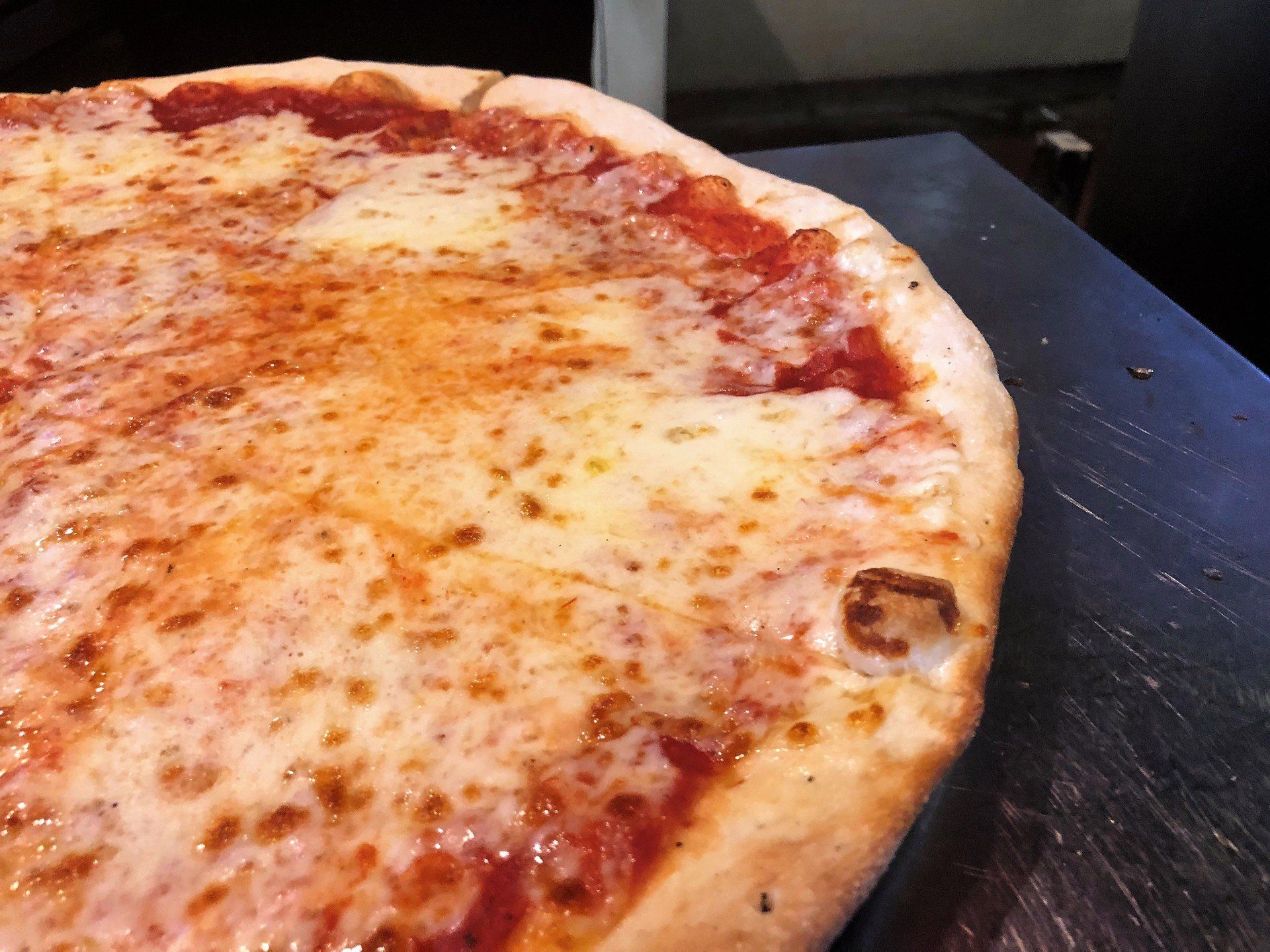 Big Louie’s Pizzeria pizza with melted mozzarella cheese