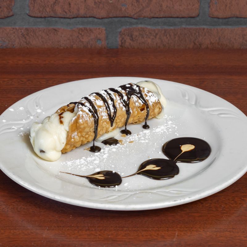 Big Louie’s Pizzeria chocolate-topped cannoli dessert