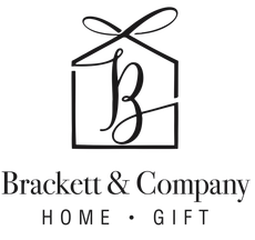 Black-and-white Brackett & Company Home + Gift logo with a bow-topped house and stylized “b” monogram