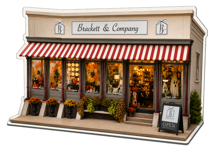 Miniature storefront with red-and-white awning, flower boxes, and warm-lit windows, labeled “Evelyn & Company”