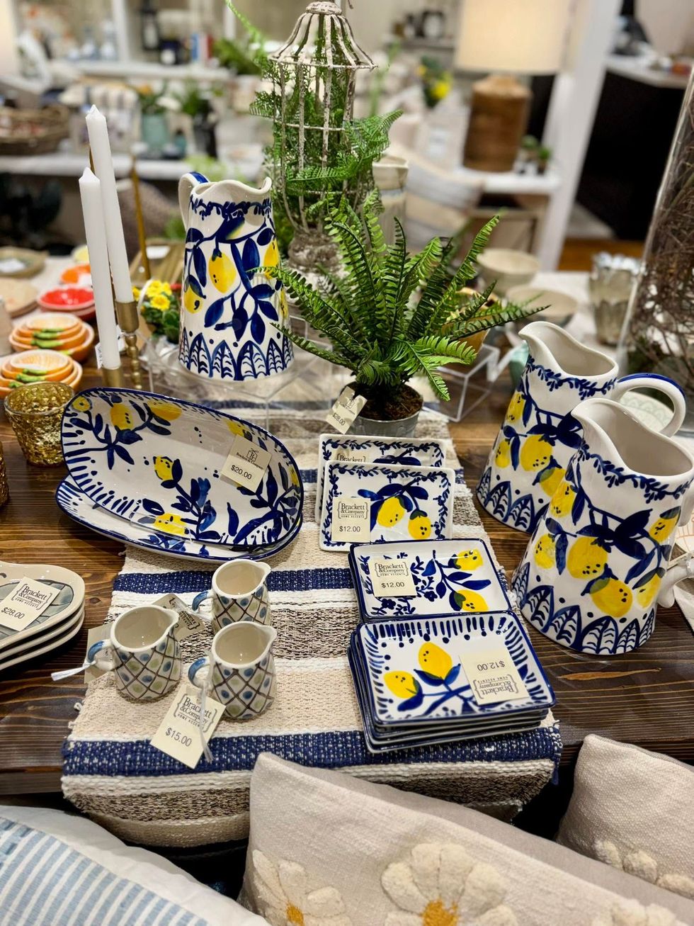 Blue-and-white floral ceramic tableware and decor displayed on a store shelf