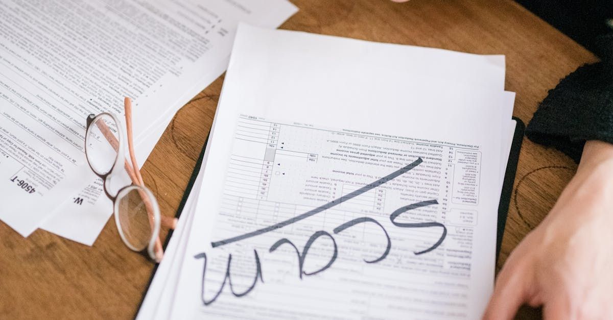 A person is holding a piece of paper with the word scan written on it.