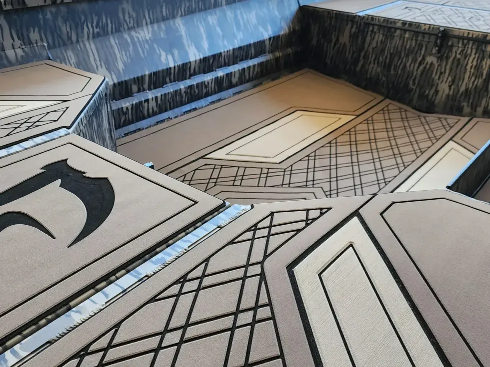 Abstract geometric floor pattern in gray, black, and beige with intersecting lines and panels