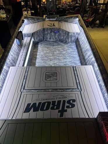Opened STHRONG-branded truck bed liner display at a store, white and gray with black trim