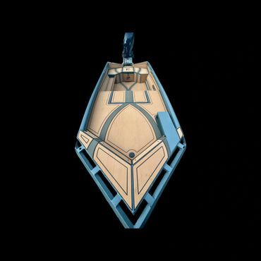 Small geometric hanging pendant with tan and blue panels on a black background