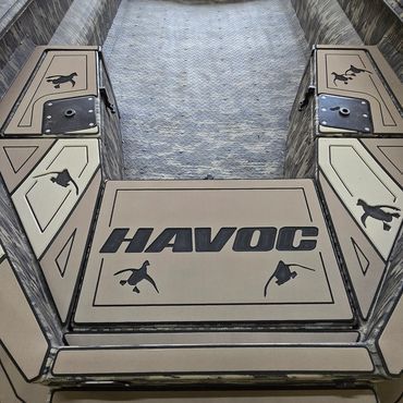 Arcade pinball machine with tan and black artwork labeled “HAVOC” viewed from the front