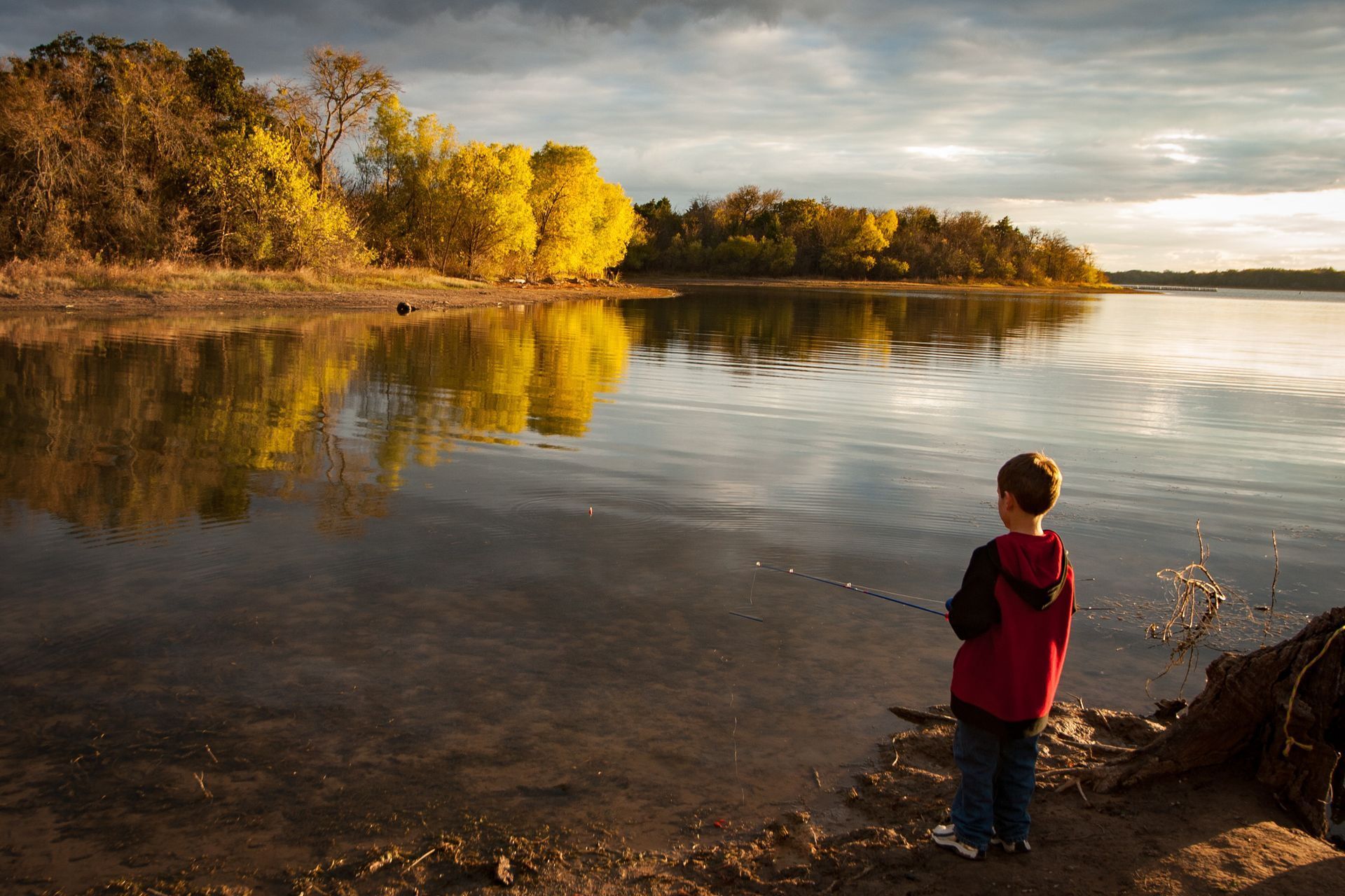 boy fishing on ranch in dallas texas