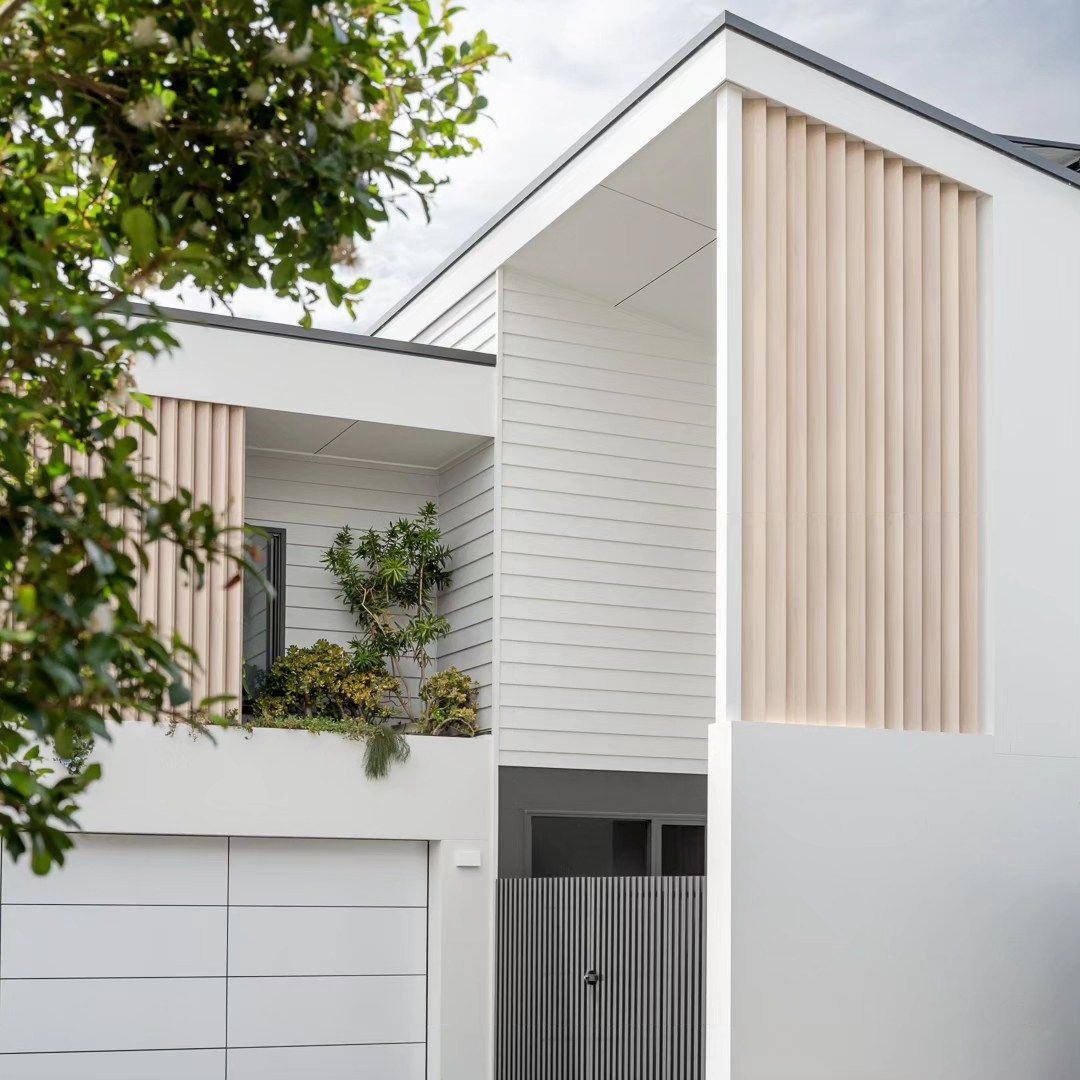 Modern White Two Story House with Vertical Wood Slats and A Garage — QBC Constructions In Kiama, NSW