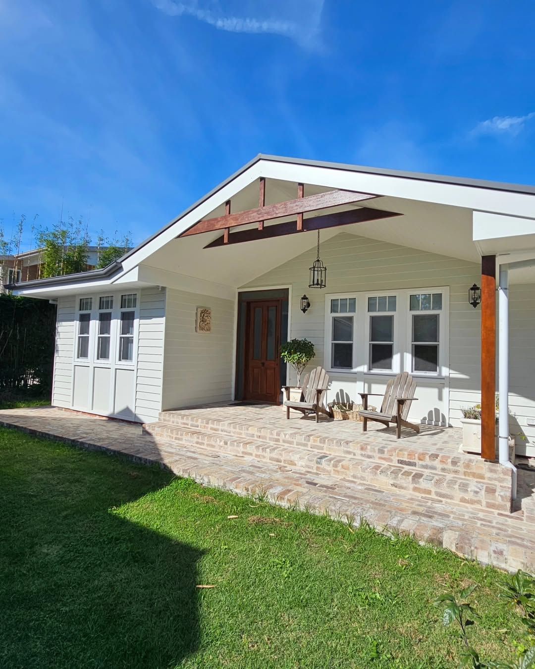 White House with Stone Porch and Wooden Door — QBC Constructions In Kiama, NSW