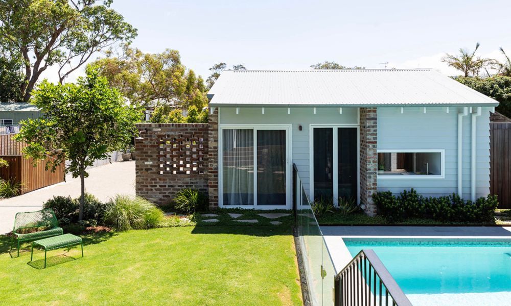 A Small House With a Swimming Pool in the Backyard — QBC Constructions In Pacific Avenue, QLD