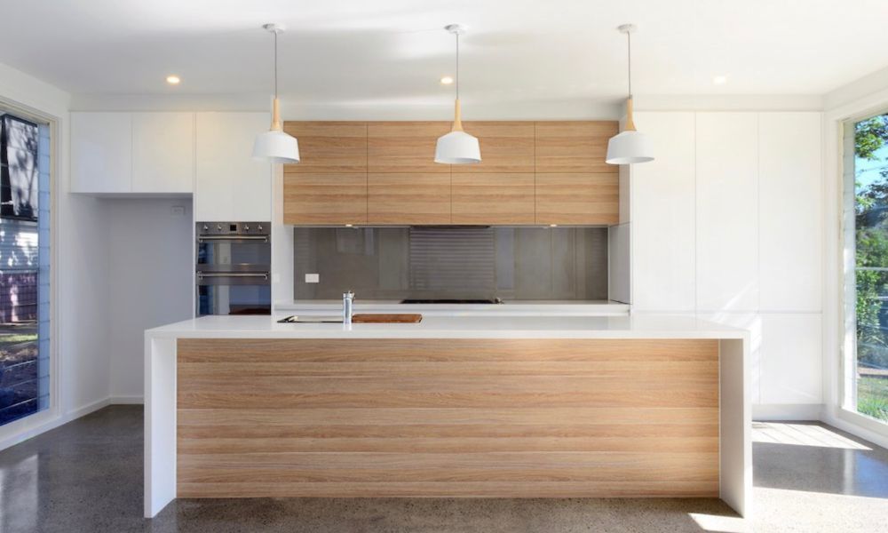 A Kitchen With White Cabinets and Wooden Cabinets — QBC Constructions In Gerringong, NSW