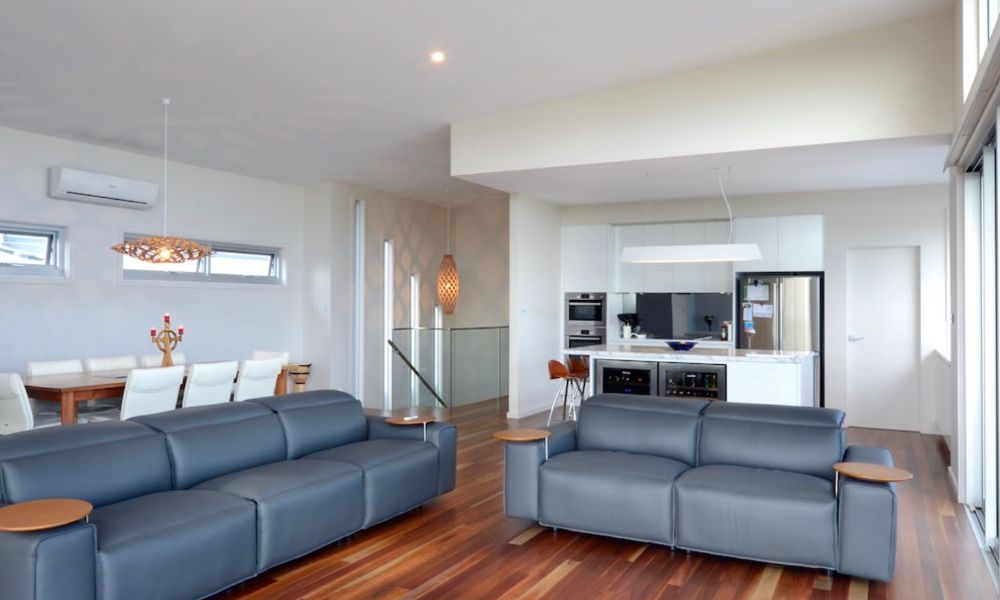 A Living Room With a Couch and a Table in It — QBC Constructions In Gerringong, NSW