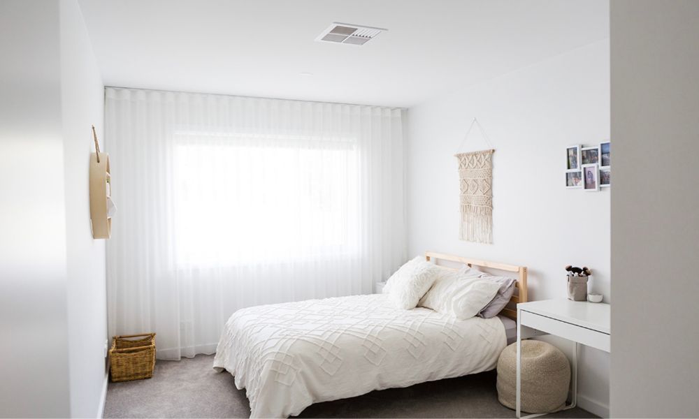 A Bedroom With a Bed — QBC Constructions In Gerringong, NSW