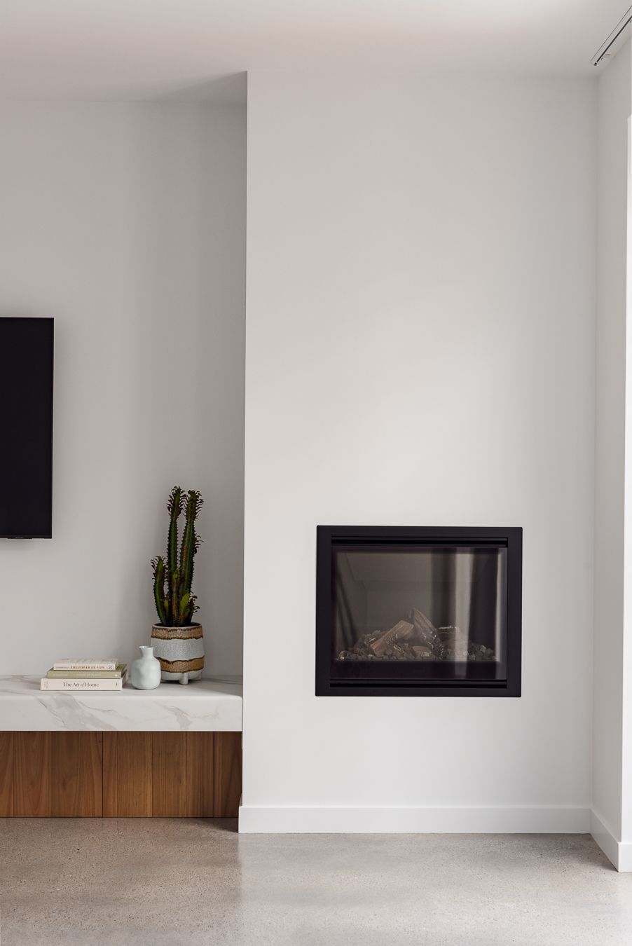 A Living Room With a Fireplace and a Flat Screen Tv — QBC Constructions In Werri Beach, NSW