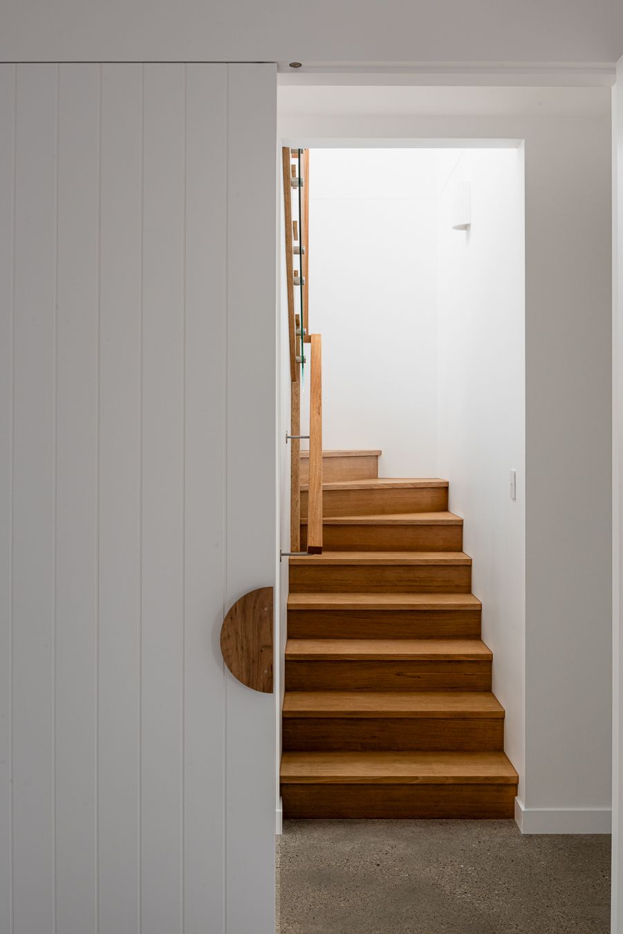 A Wooden Staircase Leading Up to the Second Floor — QBC Constructions In Werri Beach, NSW