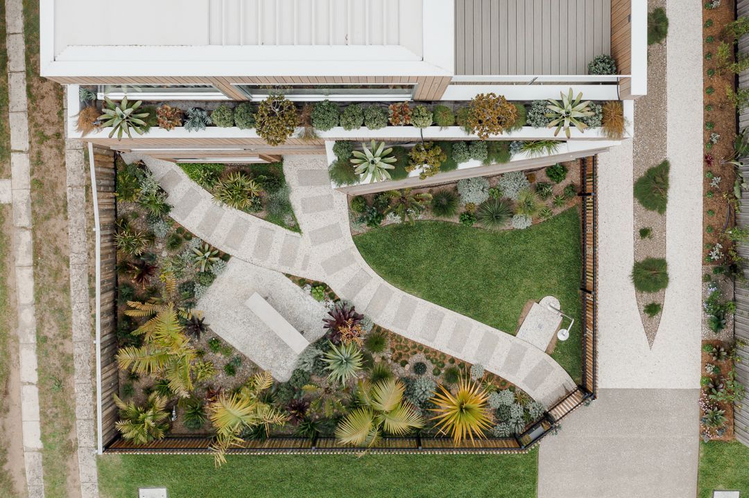 An Aerial View of a House With a Lush Green Lawn — QBC Constructions In Werri Beach, NSW