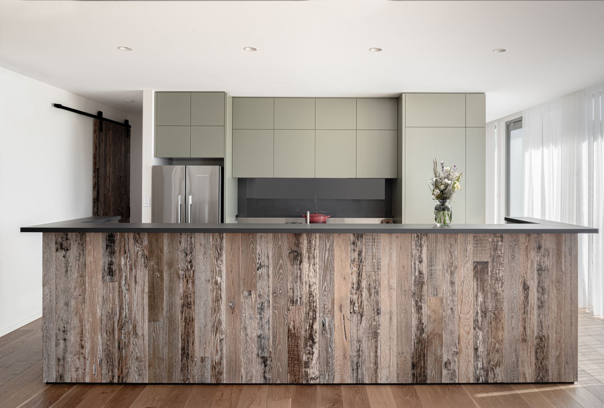 A Kitchen With Wooden Cabinets and a Stainless Steel Refrigerator — QBC Constructions In Seven Mile Beach, NSW