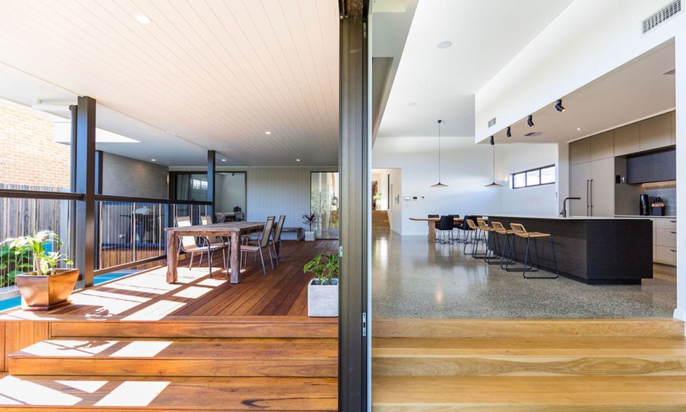 A Kitchen and Dining Room Are Connected by a Sliding — QBC Constructions In South Coast, NSW