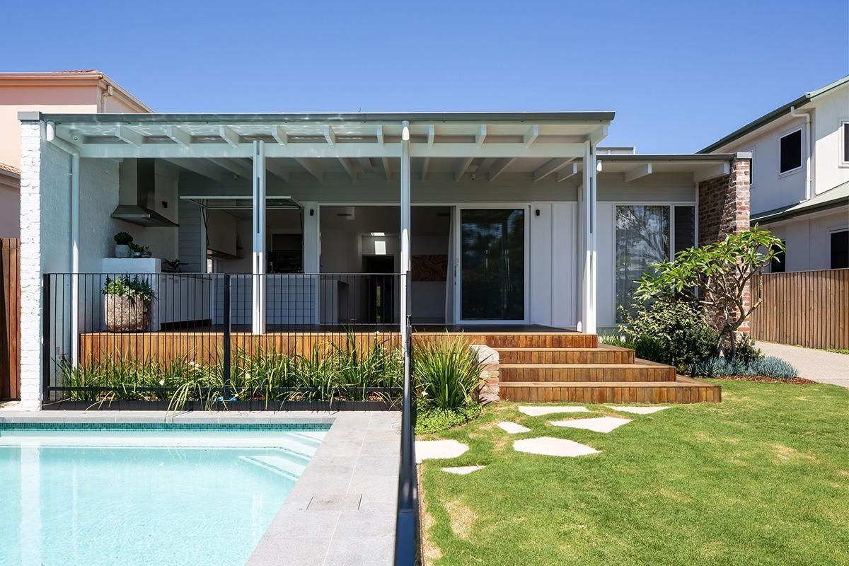A House With A Swimming Pool In Front Of It — QBC Constructions In Werri Beach, NSW
