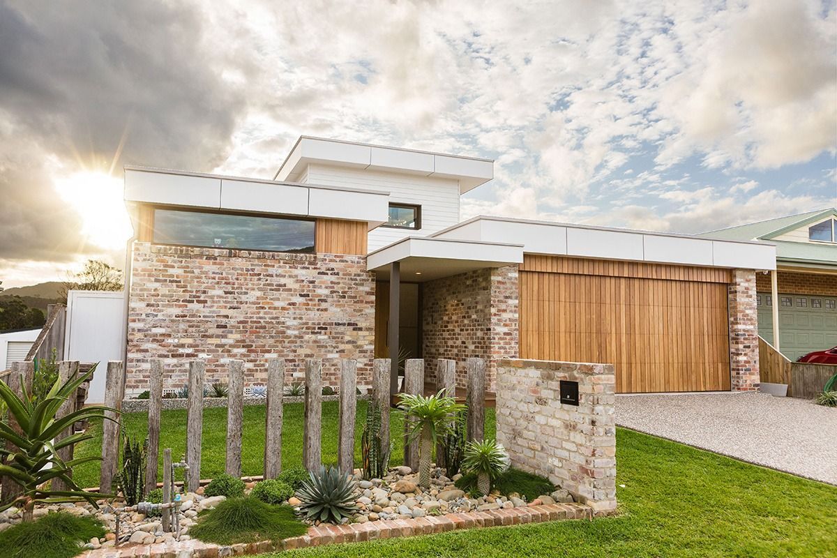 A Modern House With a Wooden Garage — QBC Constructions In Werri Beach, NSW
