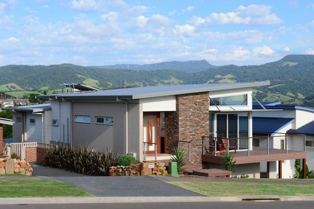 A House In A Residential Area With Mountains In The Background — QBC Constructions In Werri Beach, NSW