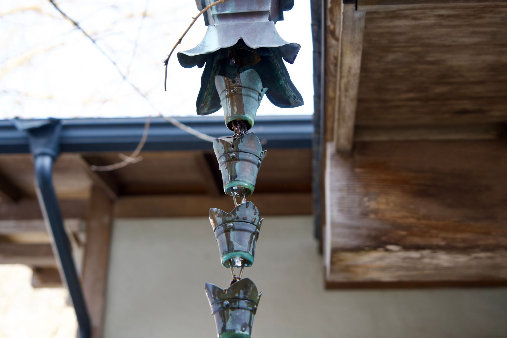 A Rain Chain is Hanging From the Ceiling of a Building