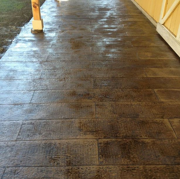 A concrete walkway that looks like a wooden floor