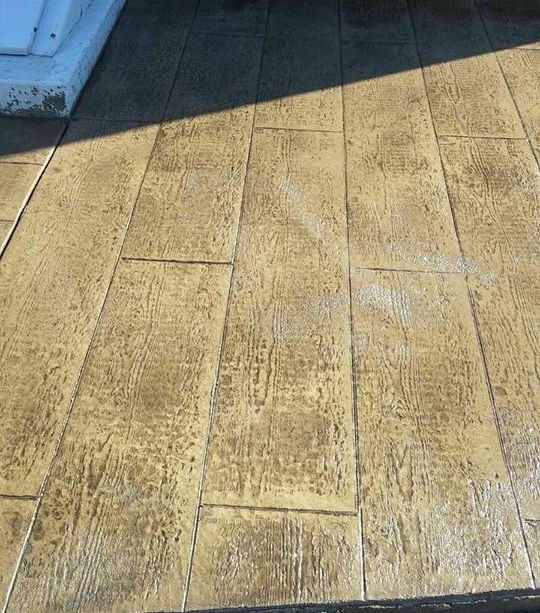 A close up of a concrete floor that looks like wood