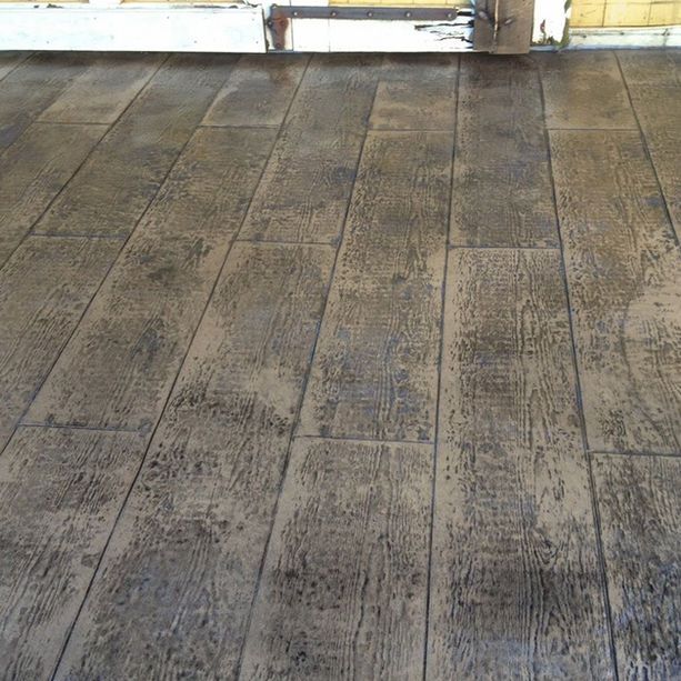 A close up of a concrete floor that looks like wood.